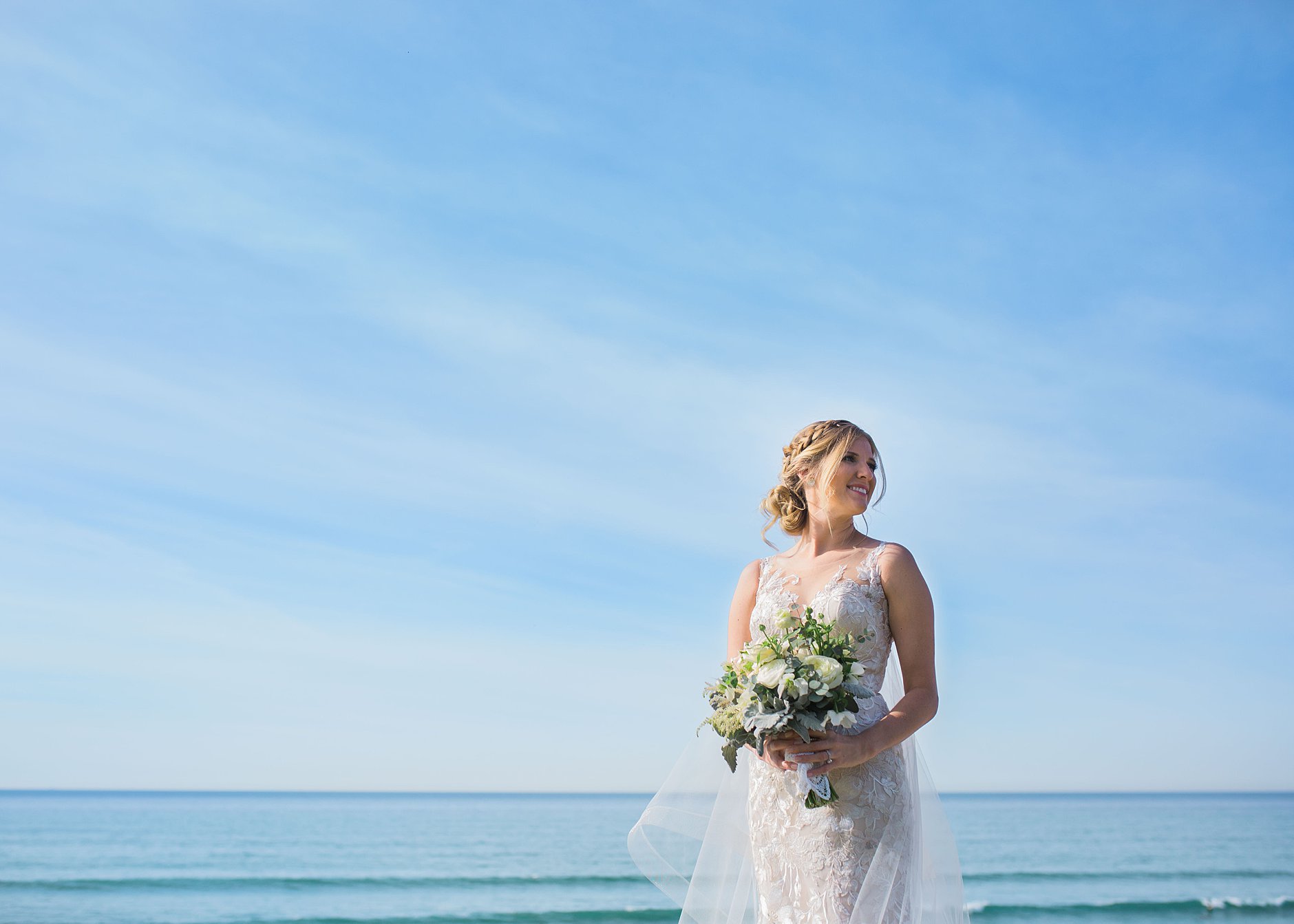 Del Mar Wedding. Ocean background portrait of a bride looking happy and radiant. 