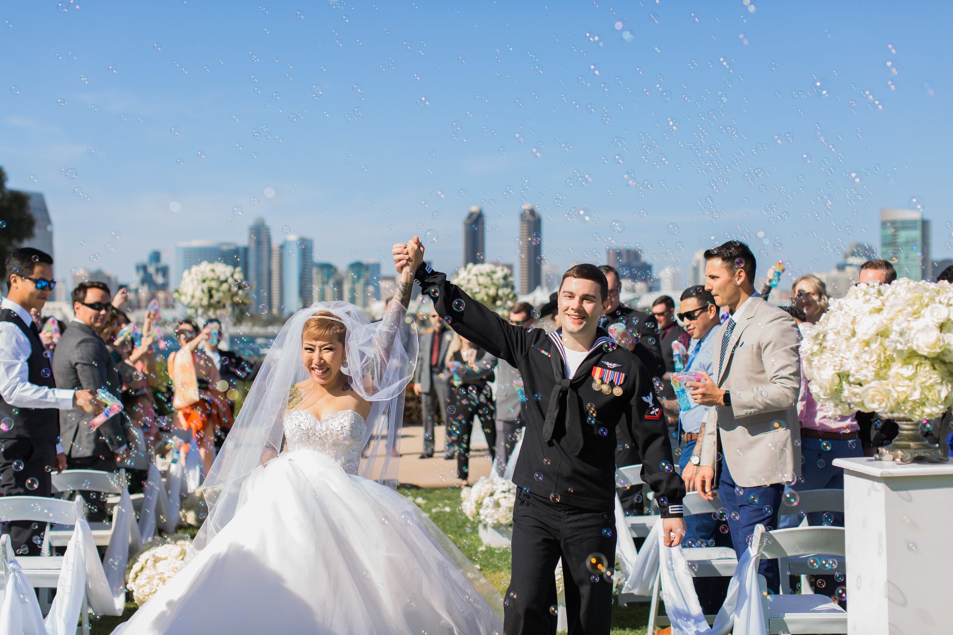 Bubbles exit at the ceremony. Coronado Island Marriott Resort & Spa. Navy Wedding. Happy moment.