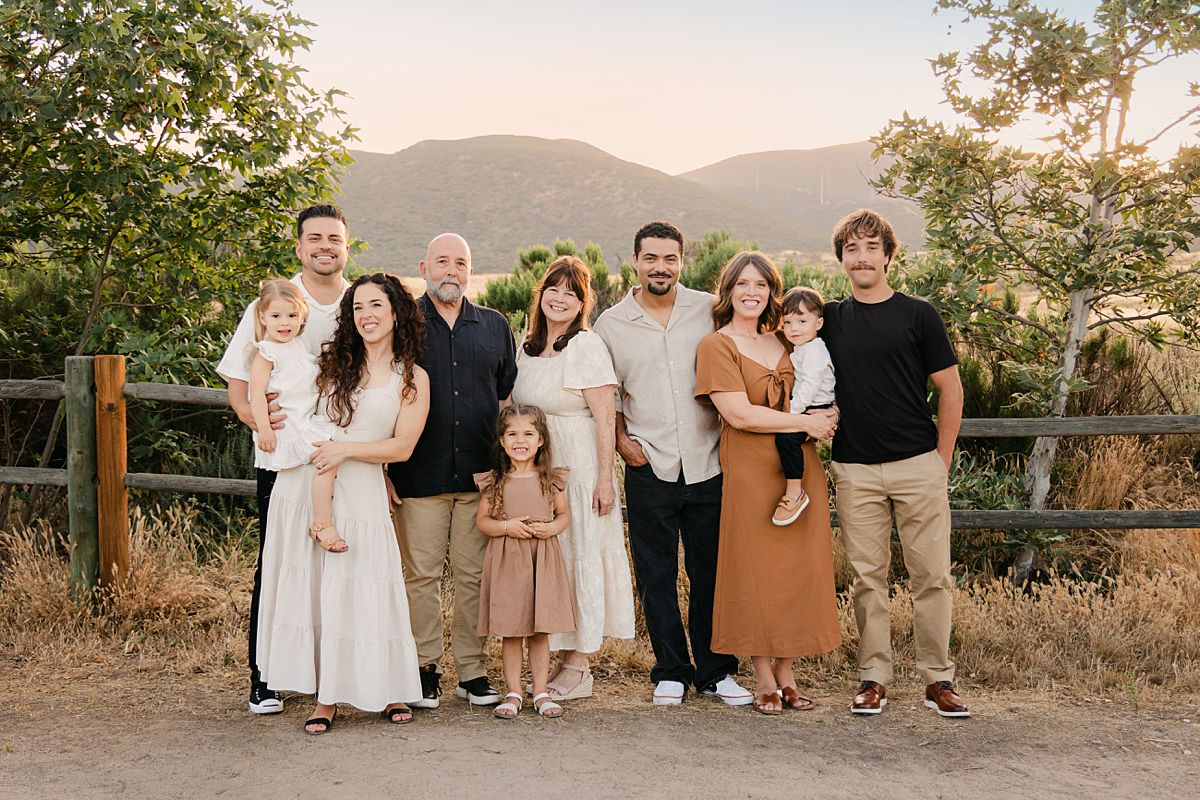 Extended family portrait at Mission Trails with grandparents, parents, and children during sunset.
